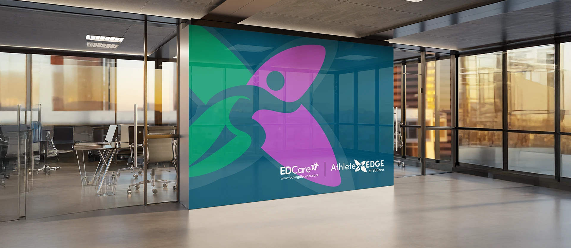 Office wall with a large EDCare Athlete EDGE design and logo