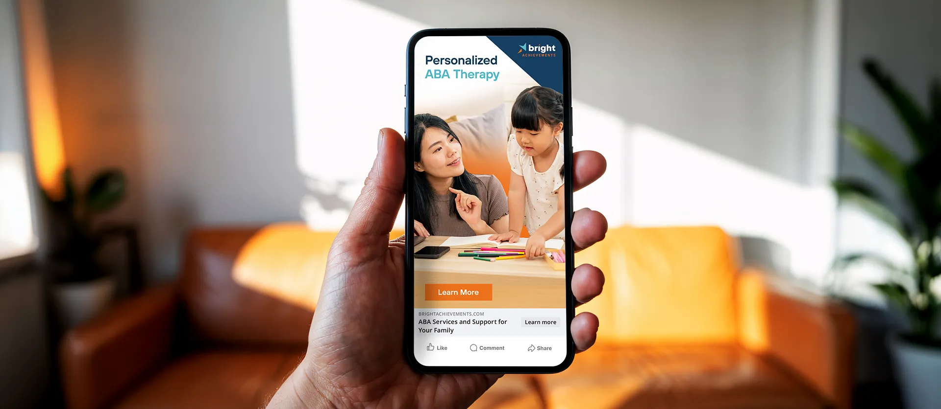 Hand holding a smartphone displaying a Bright Achievements digital ad.